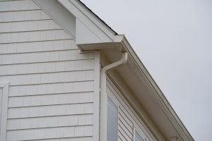 Close-up view of rain gutters on a white house